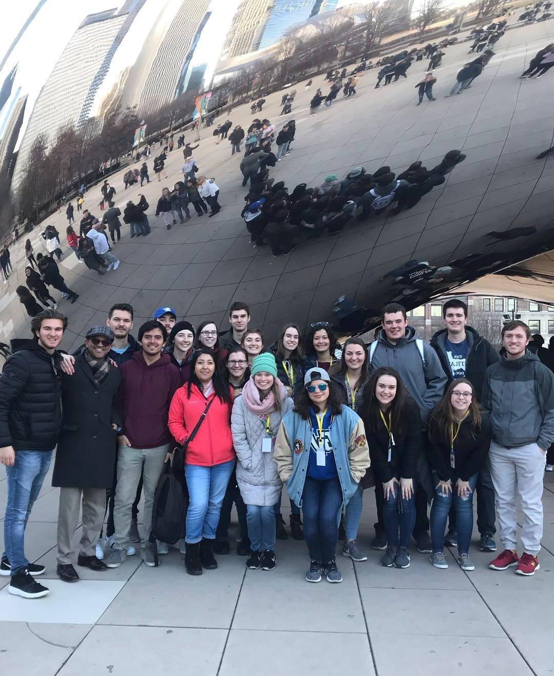 Spanish Club Chicago trip, students in front of Bean at Millennium Park